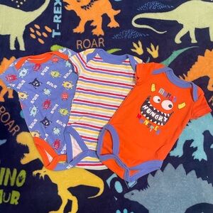 Colorful Dinosaur and Monster Themed Baby Onesies